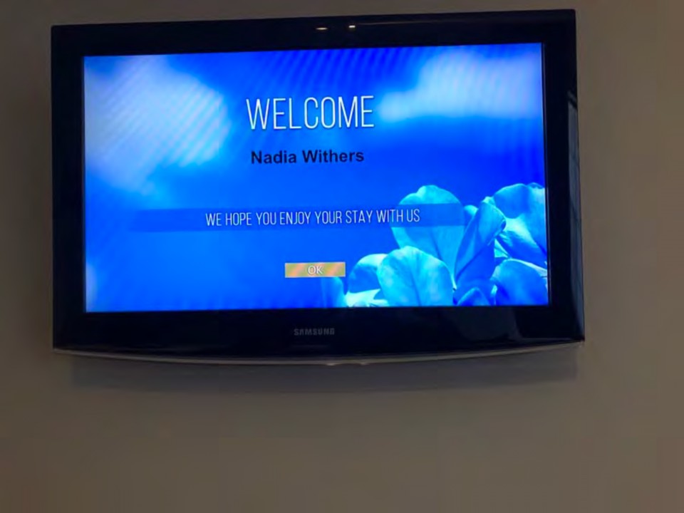 A picture containing text, wall, television, monitor

Description automatically generated